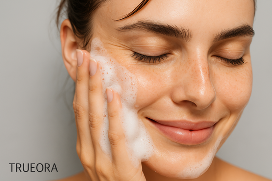 Trueora clean beauty routine close-up of woman washing face with gentle foaming cleanser for glowing skin